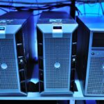 A high-performance server room with blue lights and cables