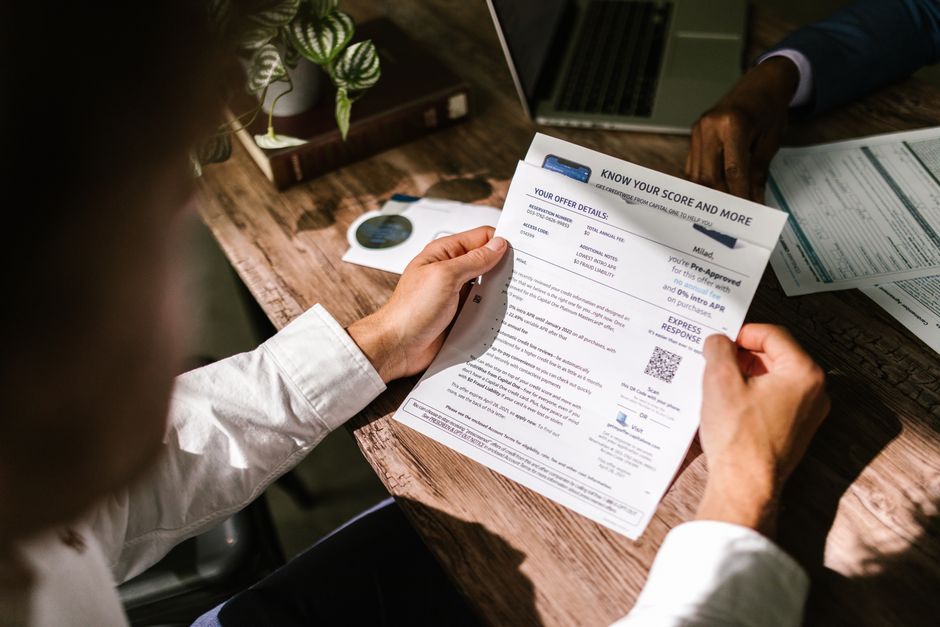 A financial manager approving general ledger codes on an expense management platform dashboard.