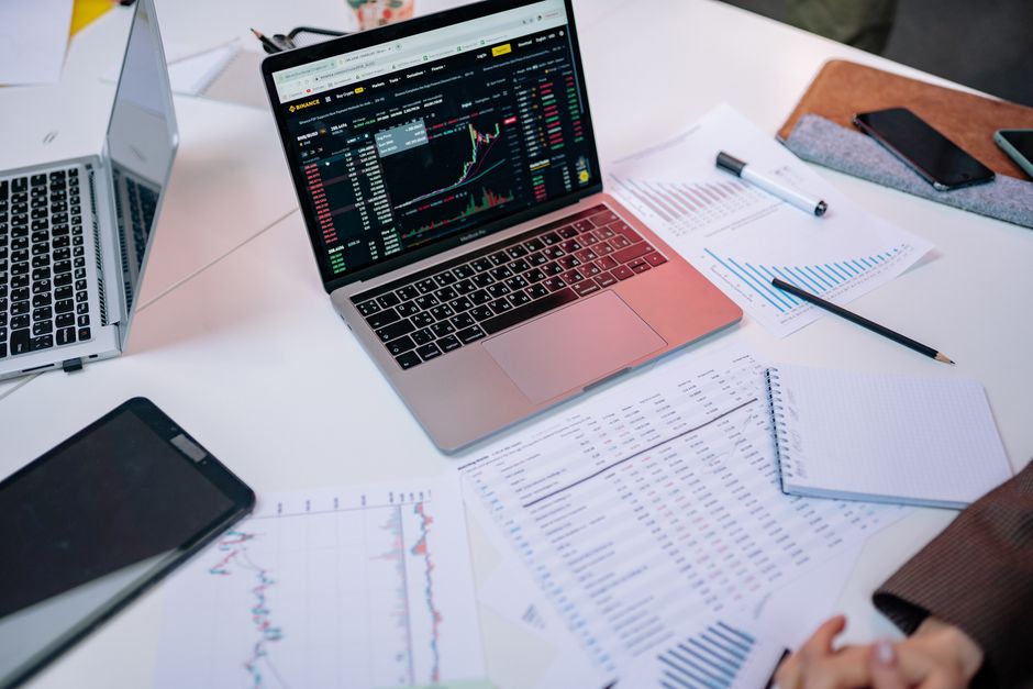 A professional analyzing corporate assets on a computer monitor