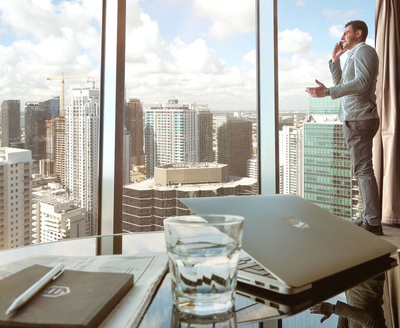 A Chief Financial Officer reviewing strategic finances with a city view