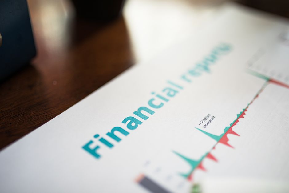 A calculator and spreadsheet showing detailed short-term and long-term cash forecasting methods.