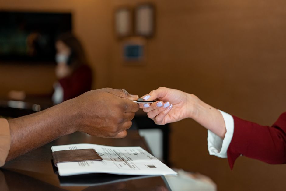 Business checks and computer-generated check stubs on a corporate desk.