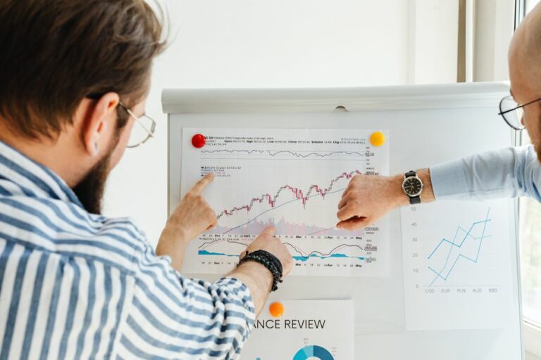 A business team discussing financial charts and corporate strategy