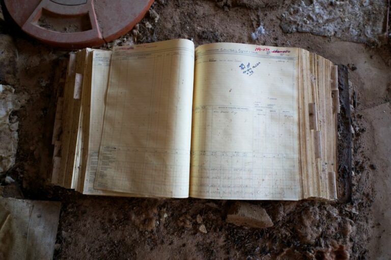 A vintage accounting journal book with numbers