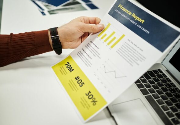 A corporate professional reviewing environmental reports on a tablet