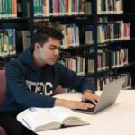 A student using a laptop to study accounting online