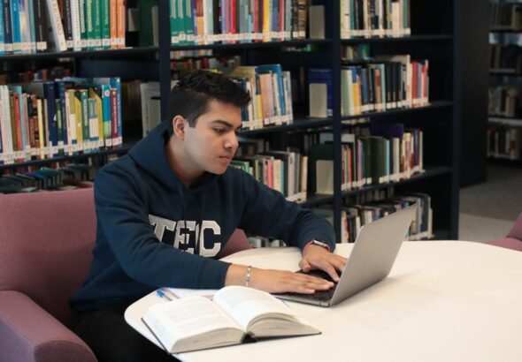 A student using a laptop to study accounting online