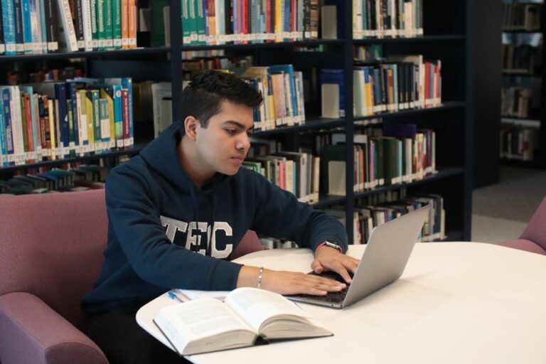 A student using a laptop to study accounting online