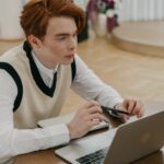 A student studying accounting online using a laptop