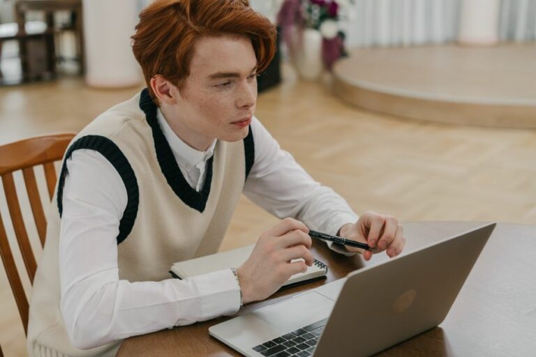 A student studying accounting online using a laptop