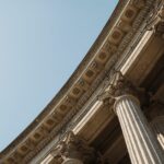 A modern financial building with classical pillar architecture