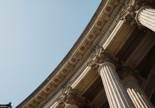 A modern financial building with classical pillar architecture
