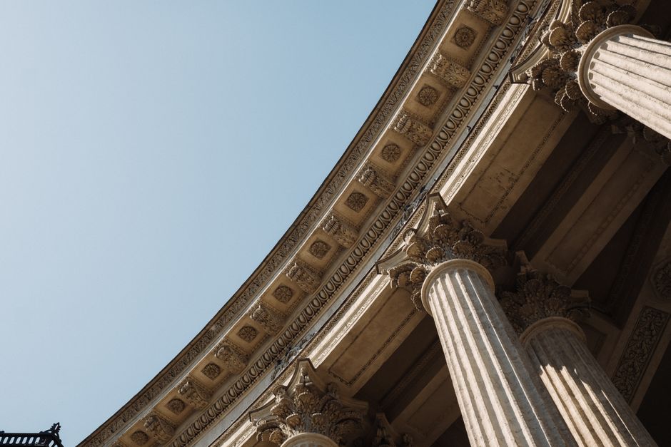 A modern financial building with classical pillar architecture