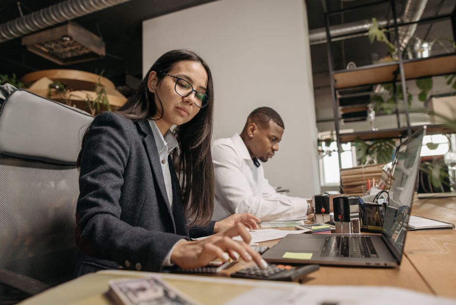 A modern accounting professional working at a desk