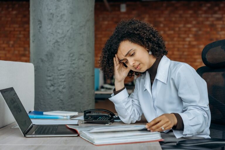 A busy financial office with empty desks indicating the accounting talent shortage
