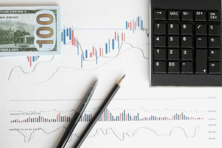 A professional accountant analyzing large financial datasets on a dual-screen dashboard in a high-tech office.