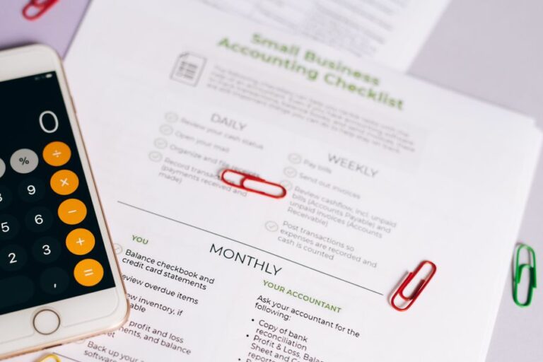 A finance professional organizing invoices, receipts, and spreadsheets on a sleek workspace.