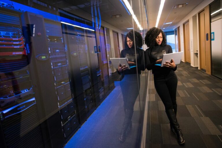 A modern workspace showing data dashboards and server rooms, representing AI agents for accounting teams.