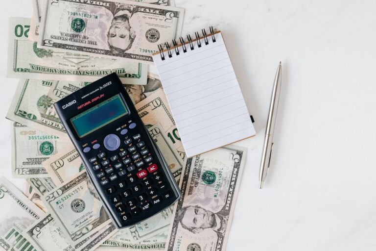 A bank check on a desk, highlighting the routing and account numbers.
