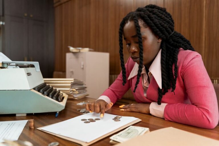 Accounting professional reviewing financial documents at a desk