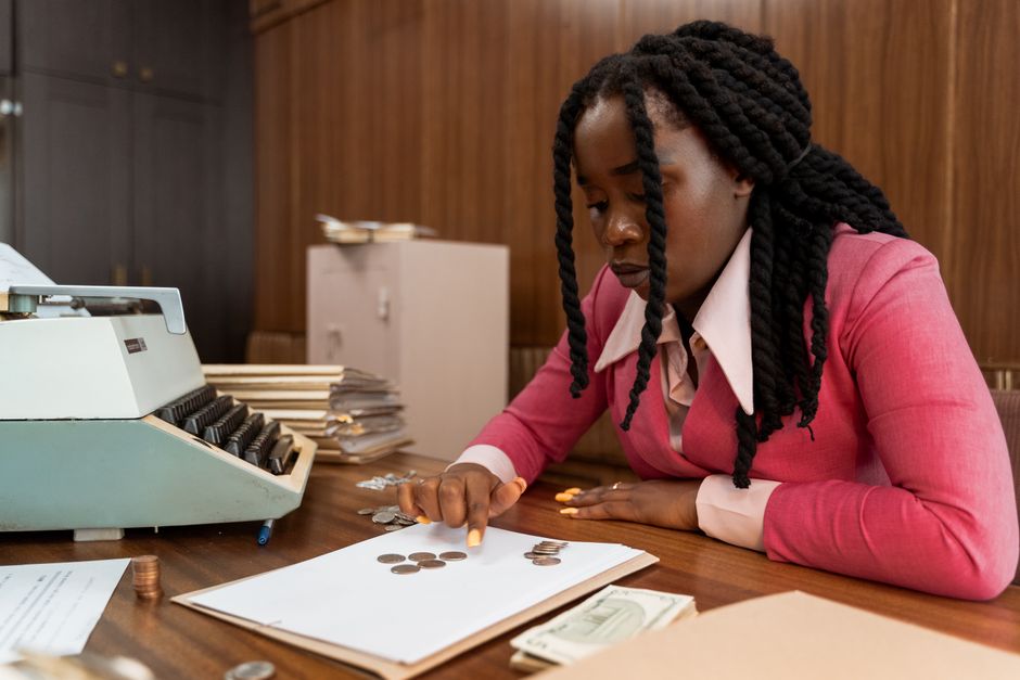 Accounting professional reviewing financial documents at a desk