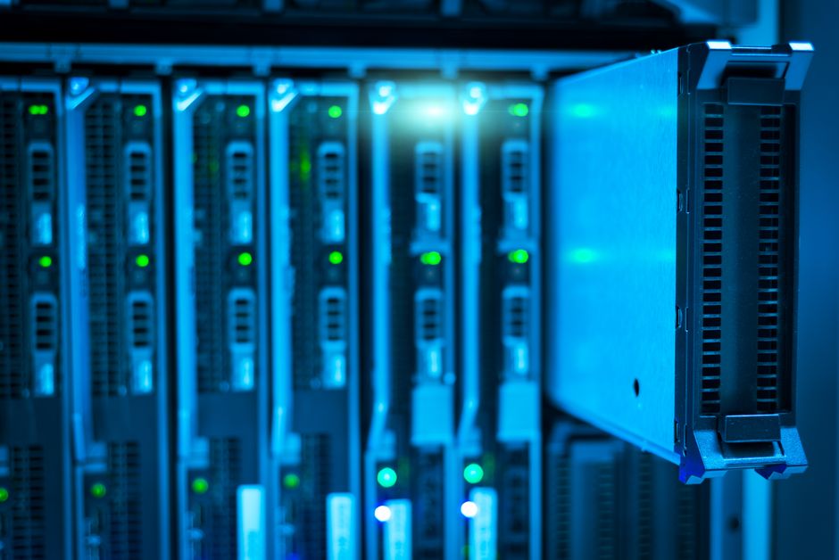 A modern cloud computing server rack glowing in a data center