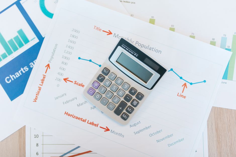Calculator and financial documents for EBITDA calculation