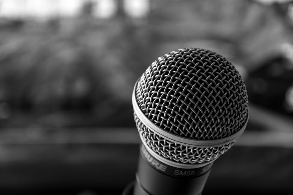 A lectern with multiple microphones ready for a major financial press conference.