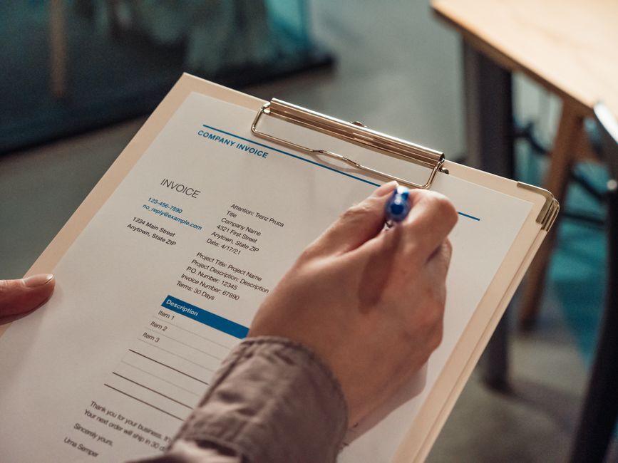 An onboarding specialist validating a vendor agreement and bank details in a corporate setting.