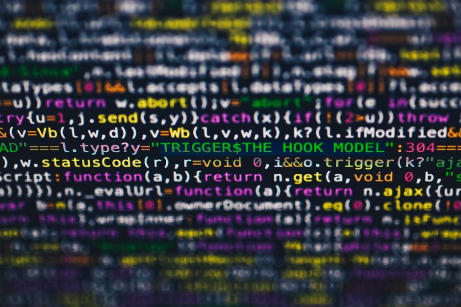 A programmer coding on a computer, representing the Cursor AI coding platform acquisition.