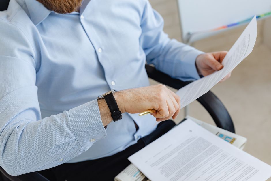 A corporate controller reviewing and approving a reconciliation packet.
