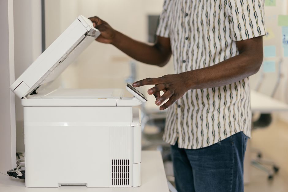 Document scanning and digital bookkeeping workflow in a small business office.