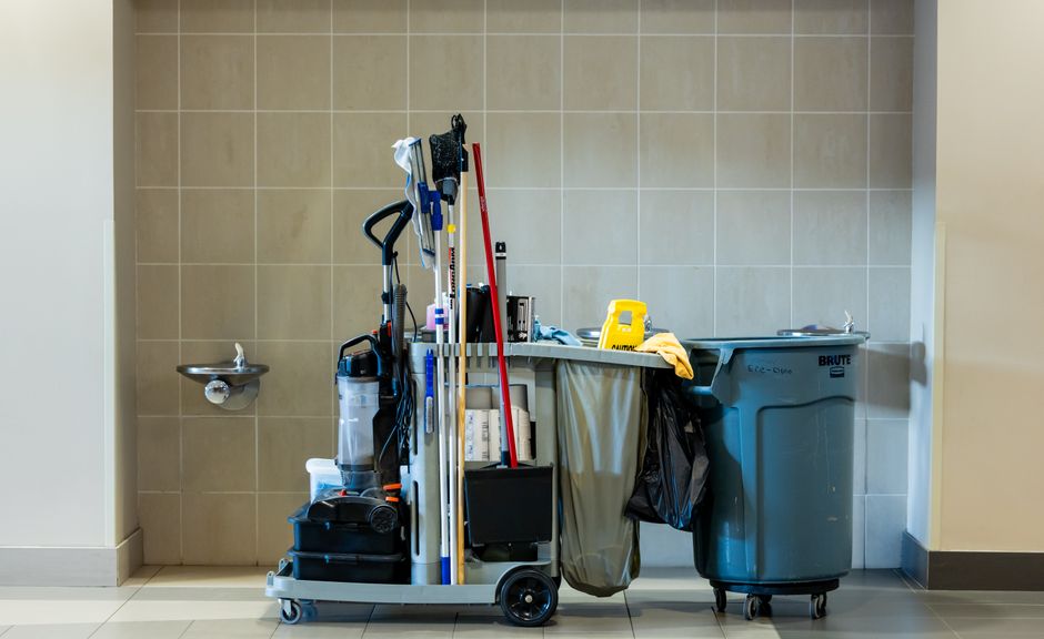 Commercial janitorial staff cleaning an office building representing cleaning service accounting methods