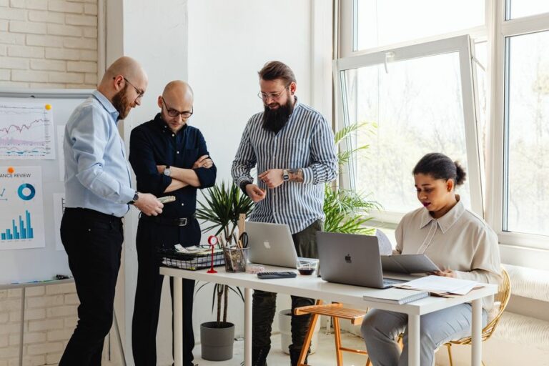 Technology startup founders reviewing accounting procedures and financial reports