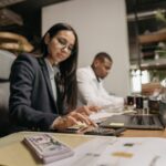 Small business owner comparing cloud accounting solutions on a laptop