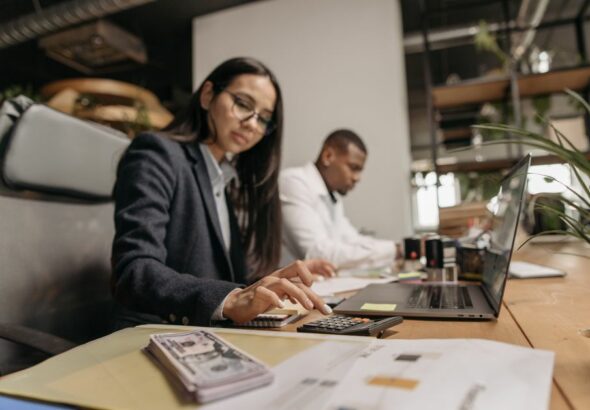 Small business owner comparing cloud accounting solutions on a laptop