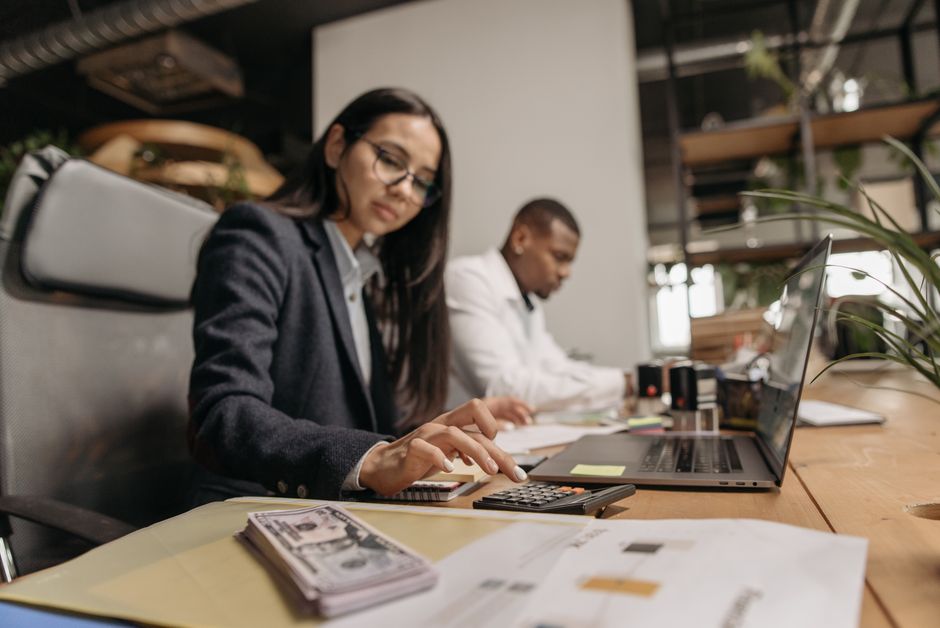 Small business owner comparing cloud accounting solutions on a laptop