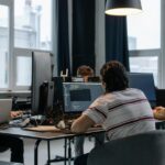 A team in a modern office evaluating enterprise business software.