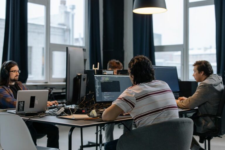A team in a modern office evaluating enterprise business software.