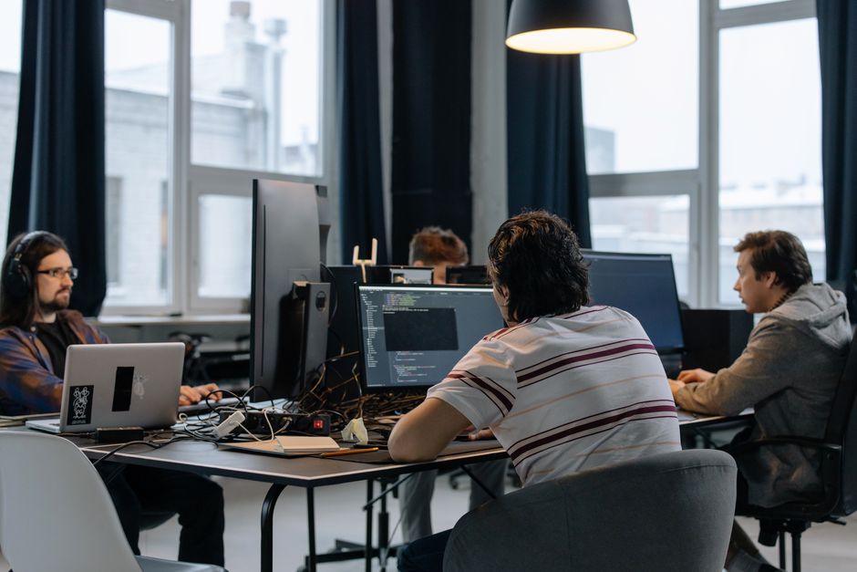 A team in a modern office evaluating enterprise business software.