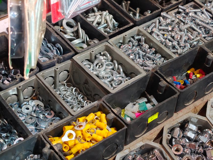 Hardware and plumbing supplies stored in a contractor service vehicle.
