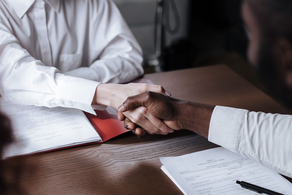 Business contract document signing representing transactional events.