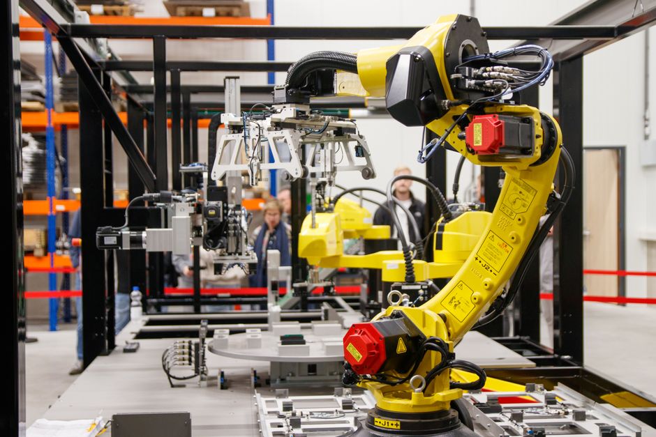 Heavy robotic assembly machinery on an automotive production line.