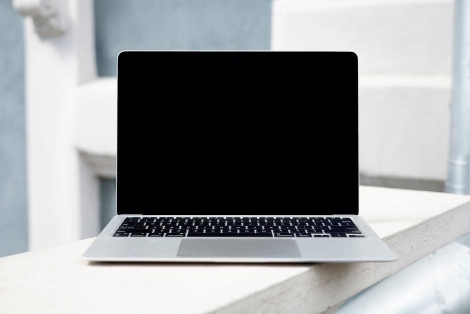 A laptop computer displaying a state tax portal for centralized filing.