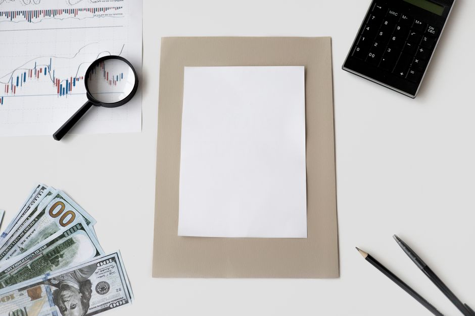 A magnifying glass highlighting a discrepancy in a financial report.