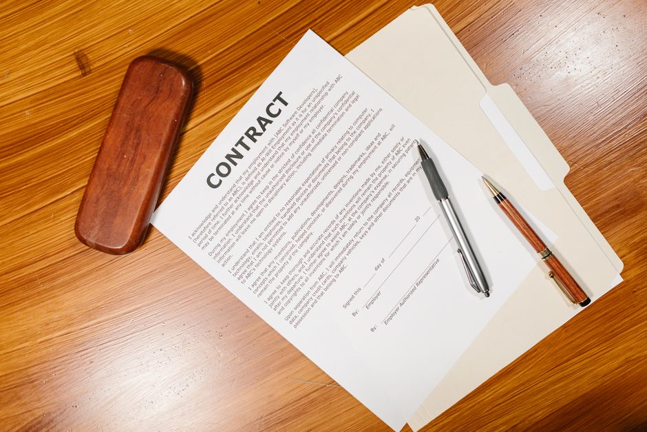 Business owner comparing bookkeeping proposals and contract terms