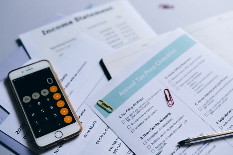 Tax documents and calculator representing IRS automatic exemption from penalty
