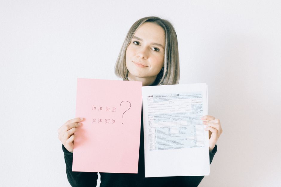 Question marks beside financial disclosure documents for frequently asked questions