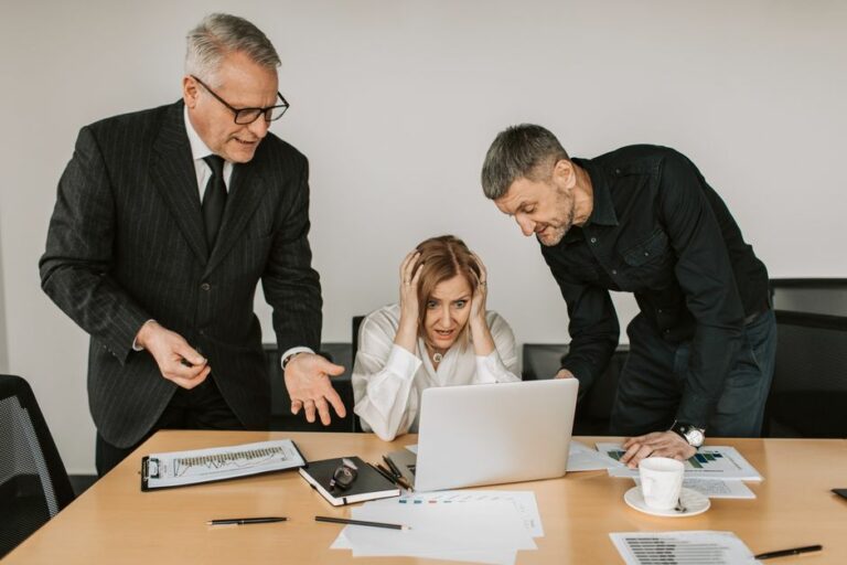 Corporate board and financial executives reviewing going concern liquidity reports