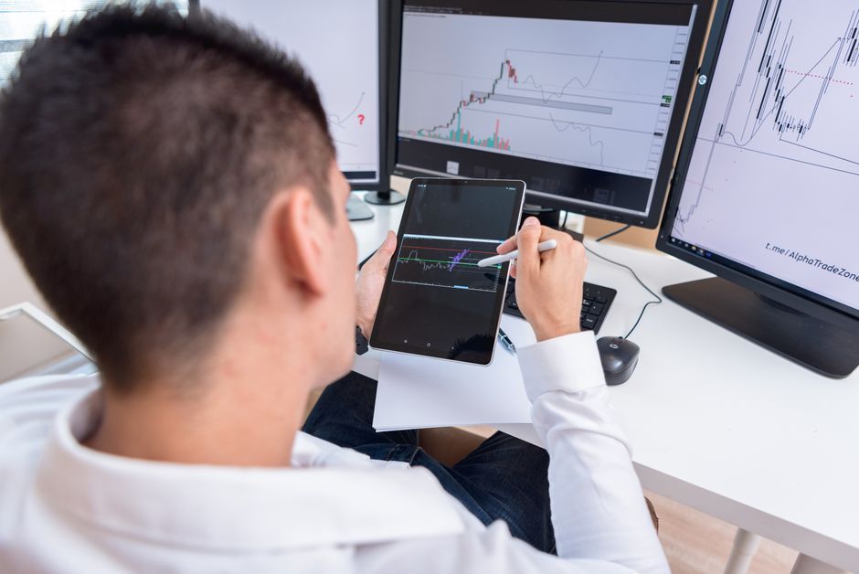 Financial analyst examining fair value measurement models for crypto assets
